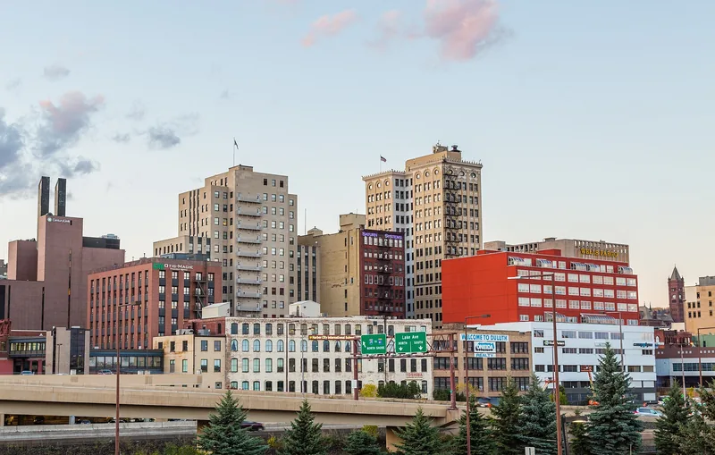 Downtown Duluth, Minnesota at dusk with the Welcome to Duluth sign